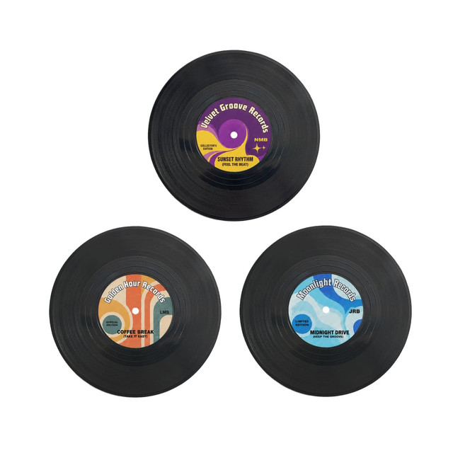 Three custom record coasters in black, featuring colourful labels with different designs and branding.