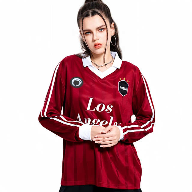 A unisex, retro-style football jersey in burgundy with white accents and a logo. Features long sleeves and a classic collar.