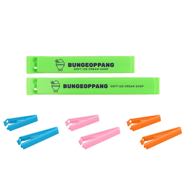 A set of medium food bag seal clips in green, pink, blue, and orange, featuring a logo.