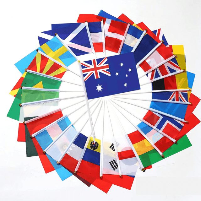 A collection of handheld flags, including the Australian flag, with various international flags on white poles.