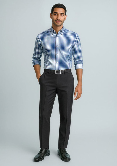A model wearing a blue and white checked shirt paired with black slimline pants and black shoes. The image features branding.