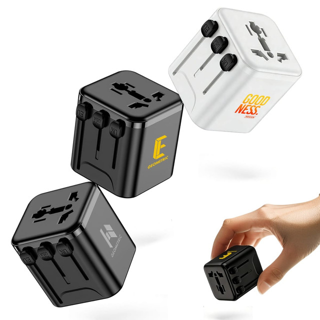 A set of three travel adapters in black and white, featuring multiple plug configurations and a logo on each.