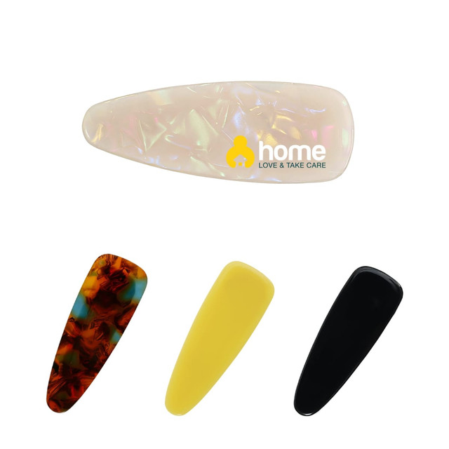 Acetate hair alligator clips in cream, tortoiseshell, yellow, and black, featuring a logo on one clip.