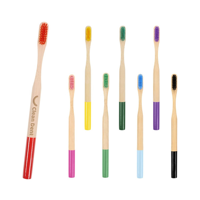 A set of colourful bamboo toothbrushes featuring various handle colours, including red, yellow, green, blue, purple, and pink.
