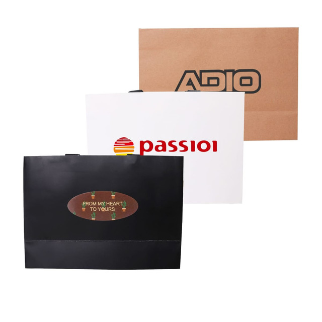 Three large paper bags in black, white, and brown, each featuring different logos and designs.