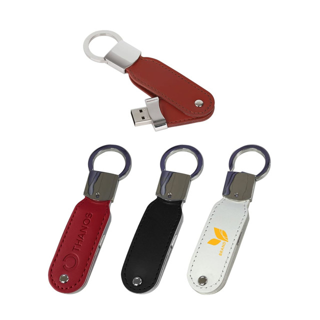 A leather swivel flash drive with a keyring, available in red, black, and white colours, featuring a logo on the surface.