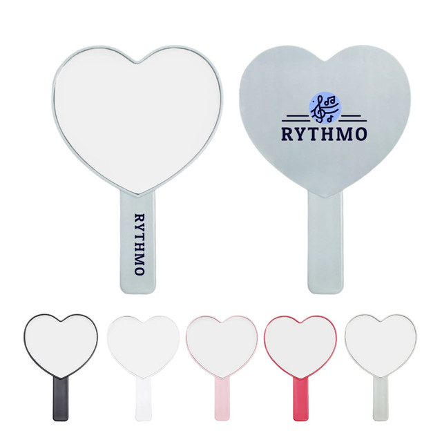 A heart-shaped handheld mirror with a handle available in black, pink, and silver, featuring a logo.