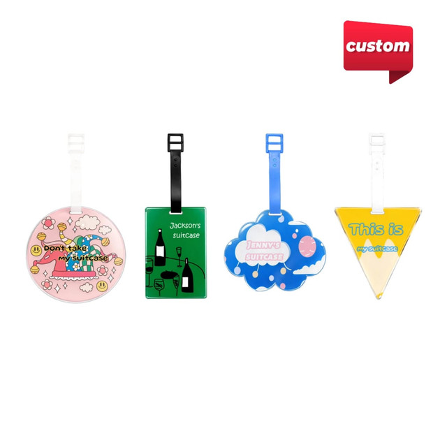 Four acrylic luggage tags in various shapes and colours, featuring different designs and a logo.