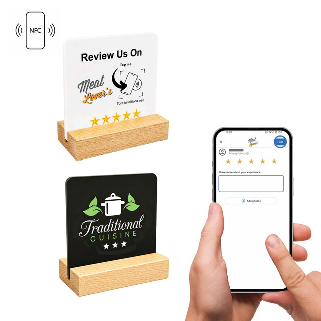 A NFC acrylic menu in white and black, displayed on a wooden stand, alongside a smartphone interaction.