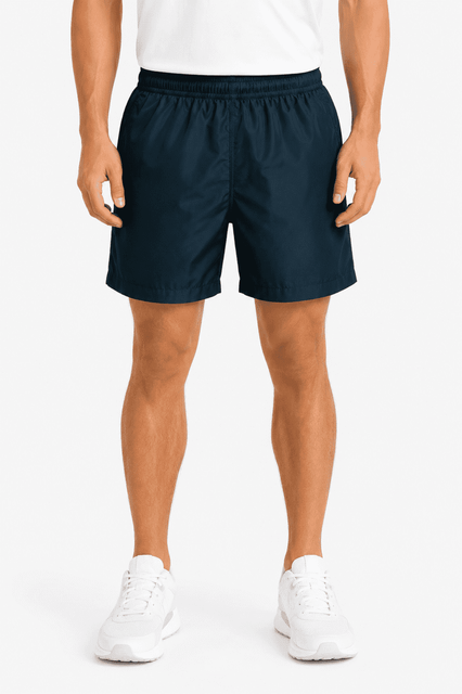 Navy blue men's sports shorts with an elastic waistband, featuring a logo, paired with white sports shoes.
