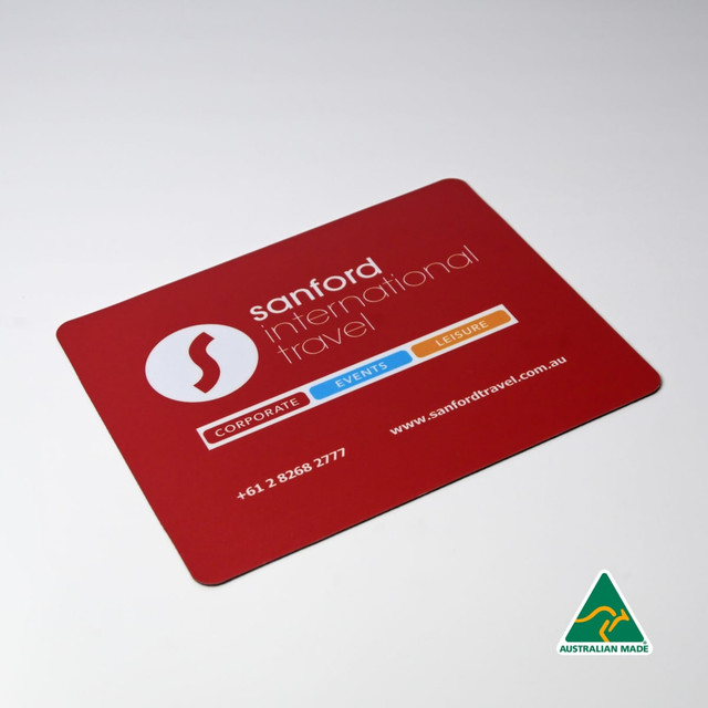 A red mouse mat featuring a logo, with contact details and categories for corporate, events, and leisure services.