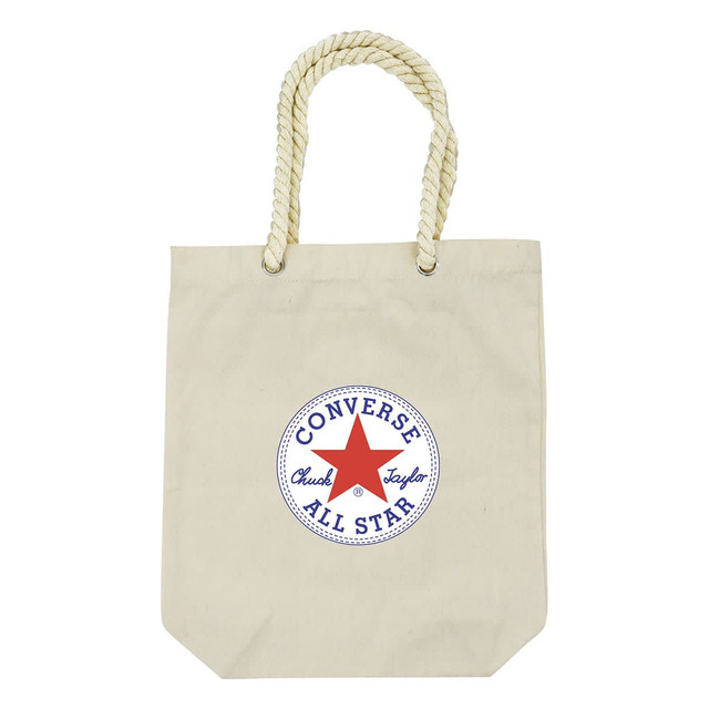 A cream tote bag with a round logo in blue and red, featuring a rope handle.