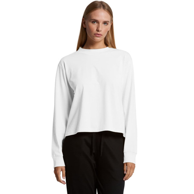 A white long-sleeve t-shirt featuring a relaxed fit and a logo, paired with black pants.