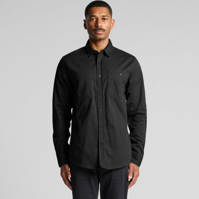 A black work shirt featuring long sleeves, a button-up front, and two chest pockets, with a logo. A black work shirt featuring long sleeves, a button-up front, and two chest pockets, with a logo.