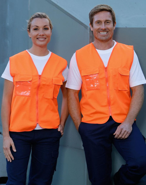 Hi-Vis safety vests in fluorescent orange with ID pockets, worn by two smiling individuals against a grey background.