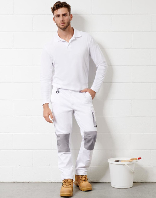Unisex utility stretch cargo work pants in white with grey accents, featuring pockets. Model wearing a long-sleeve white shirt.