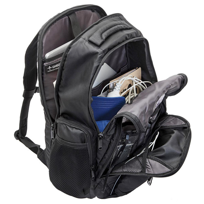 A black laptop backpack with multiple compartments, showcasing a laptop, cables, and other accessories inside.