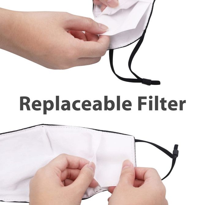 A reusable face mask with black edges and a replaceable filter, held by hands for demonstration.