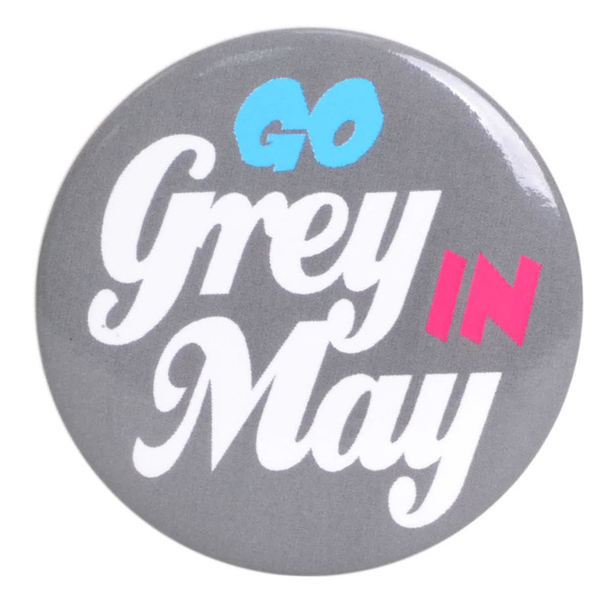 A grey button badge featuring bold, colourful text. It has a logo in the design.