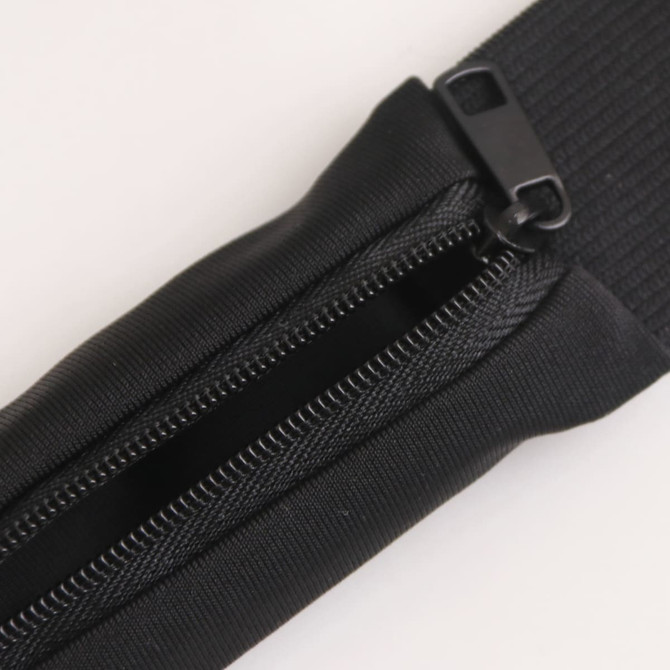 A black running belt with a zippered compartment, featuring a textured strap and a clip for secure fastening.