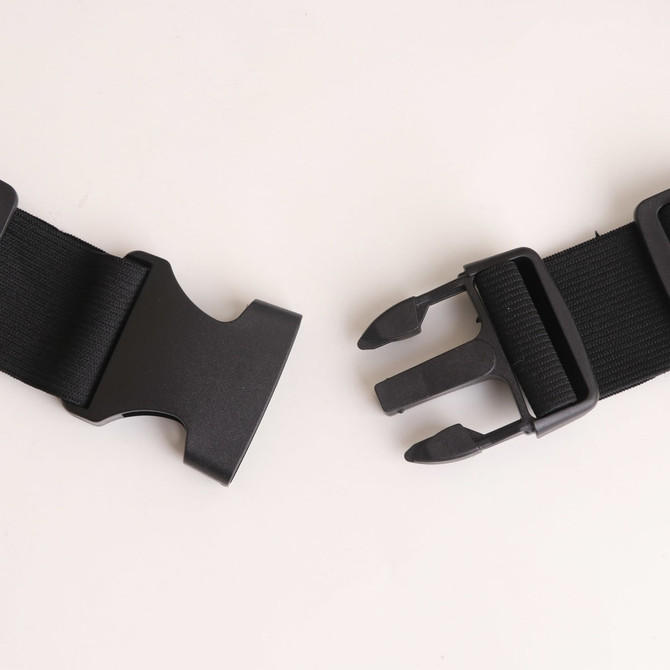 A black running belt featuring adjustable straps and a sturdy buckle for secure fastening.