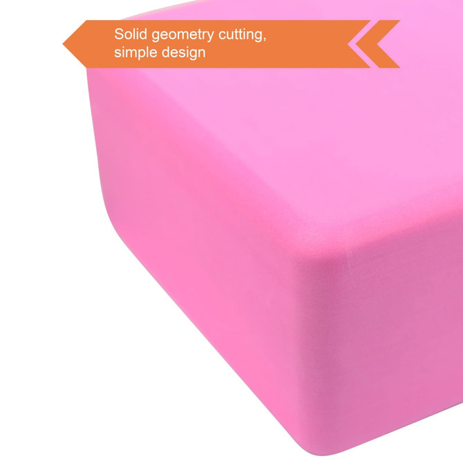 A pink EVA yoga block with solid geometry cutting and a simple design. It features a smooth, clean surface.