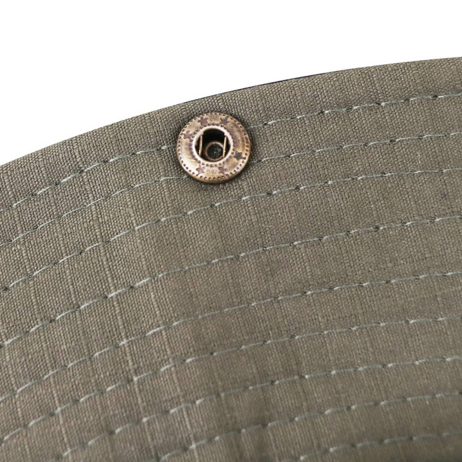 A close-up of an olive green outdoor brim hat, featuring a metal fastener.