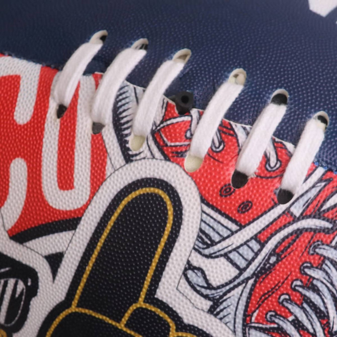 A training AFL ball in navy blue with red and white graphics, featuring stitching and a logo. 