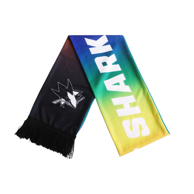 A recycled mesh fabric scarf featuring a gradient of blue, green, and yellow with a logo and fringed ends.