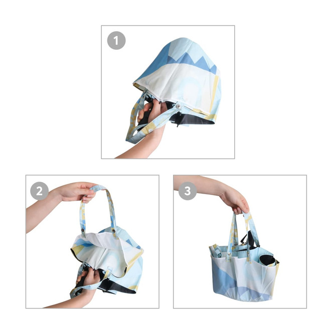 A folding umbrella in shades of blue and yellow, styled like a handbag, held in hands for demonstration. A folding umbrella in shades of blue and yellow, styled like a handbag, held in hands for demonstration.