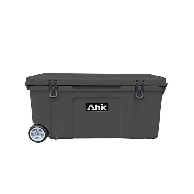 A grey cooler box with wheels and a handle, featuring a logo on the front.