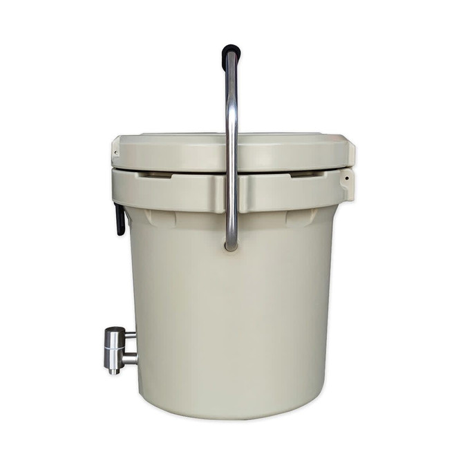 A cream-coloured ice bucket with a faucet and a silver handle, featuring a logo on the side.