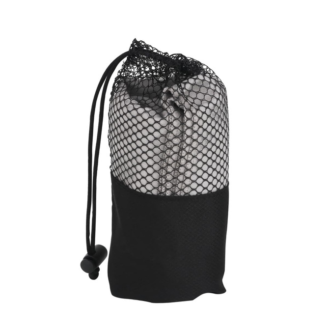 A quick dry towel in a black mesh storage bag, featuring a drawstring closure and sleek design.