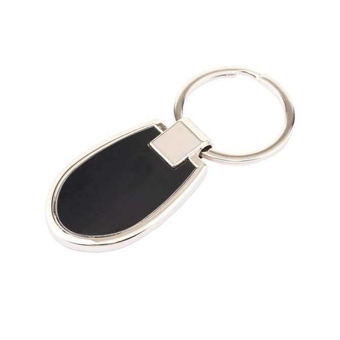 A silver keyring with a black oval-shaped pendant, featuring a sleek design and a branding logo.