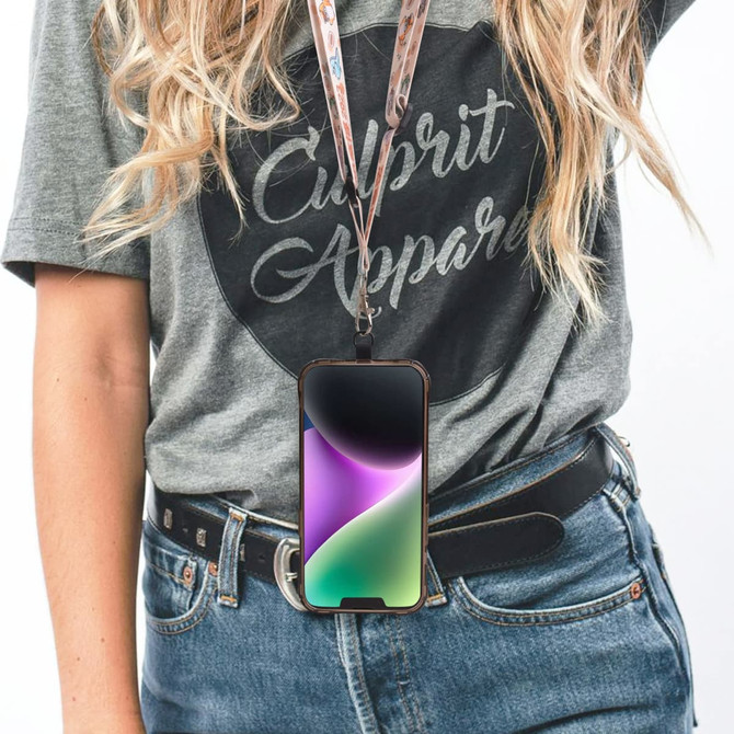 An adjustable phone lanyard in a patterned design, holding a smartphone at a person's waist. The lanyard features multiple colours.
