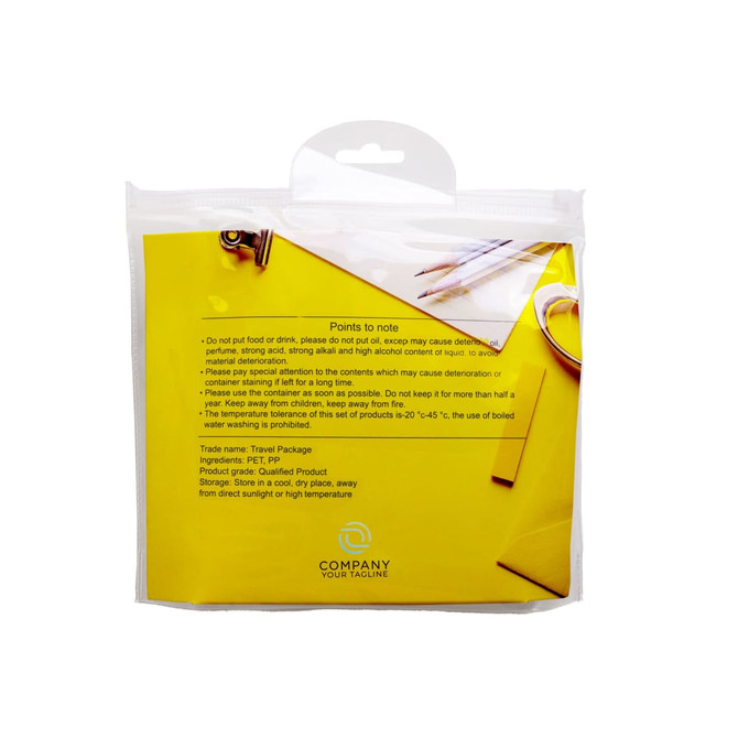 A travel toiletry kit in a clear bag with a yellow background, containing empty bottles and accessories.