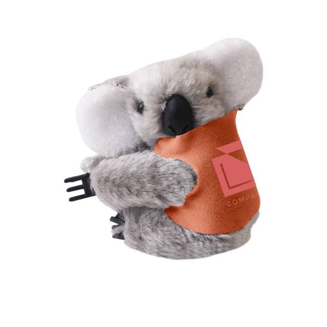 A grey koala plush toy with a brown pouch, featuring a logo on the pouch.