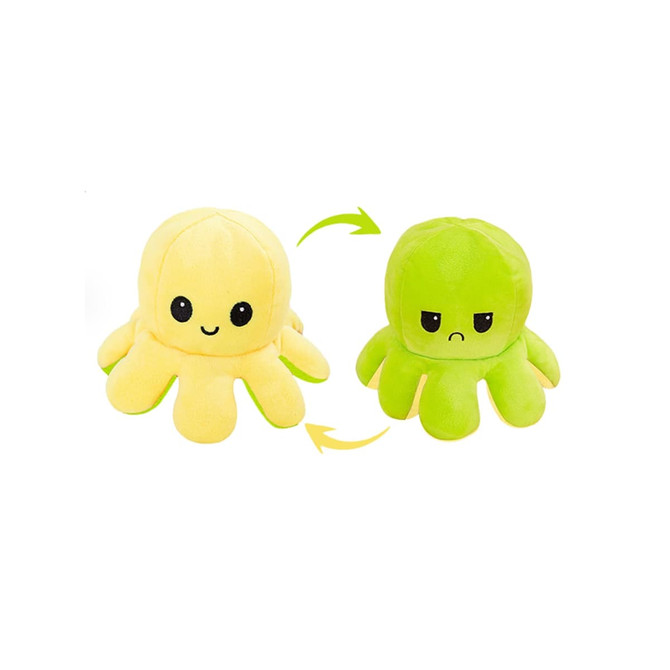 A large reversible octopus plush toy in yellow and green, featuring a happy face on one side and an unhappy face on the other.