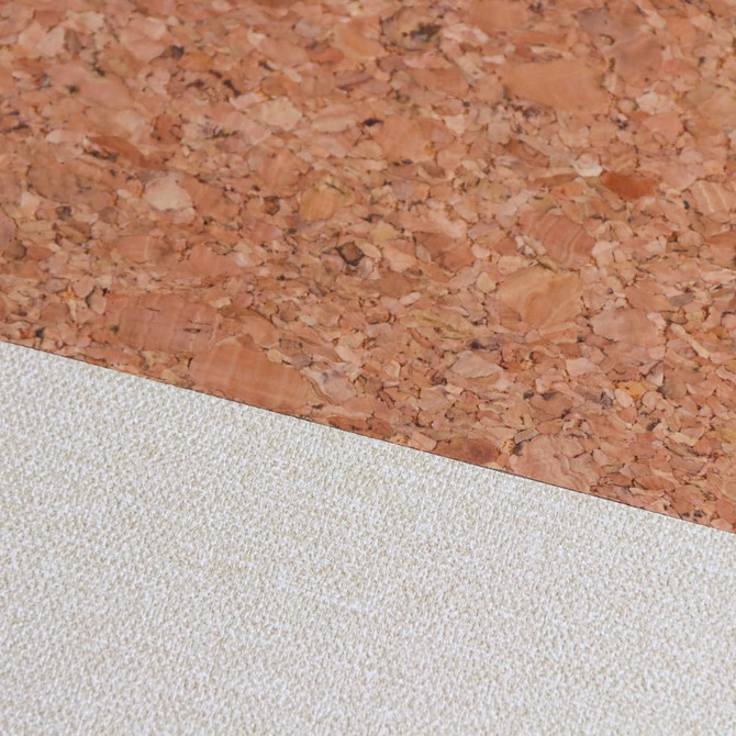 A natural cork top and cream cotton bottom of an A5 notebook, featuring a textured surface with a logo.