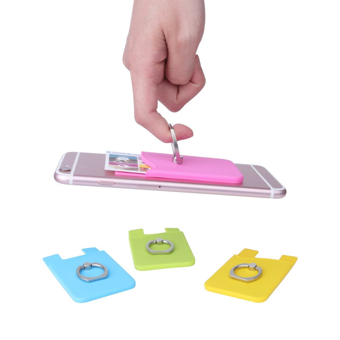A hand holding a pink smart wallet with a ring attached to a smartphone, alongside green and yellow wallet options.