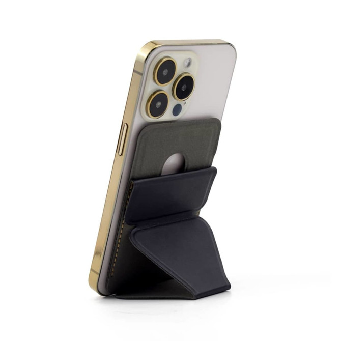 A black PU MagSafe phone stand card holder attached to a gold smartphone, featuring a built-in wallet.