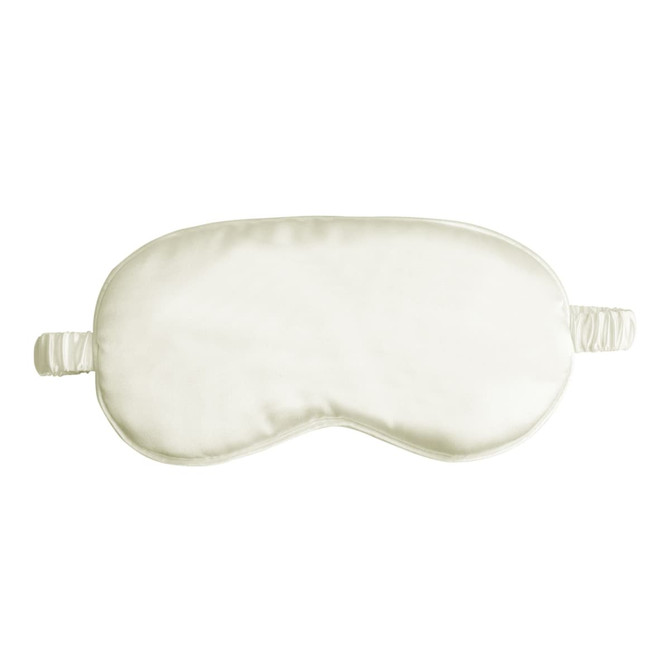 A satin sleep mask in a soft cream colour, featuring elasticated straps for comfort.