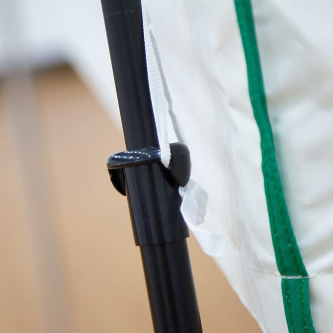 A close-up of a specially designed attachment on a black pole, featuring a green and white tent fabric.