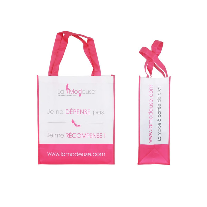 A pink and white laminated non-woven bag with large gusset and two handles. Features a logo and promotional text.