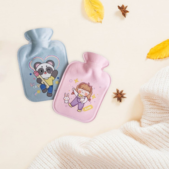 A blue and a pink hot water bottle with plush covers, featuring cute cartoon designs, on a textured background.