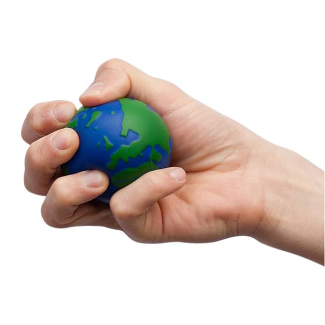 A hand squeezing a round stress reliever designed to look like Earth, featuring blue and green colours.