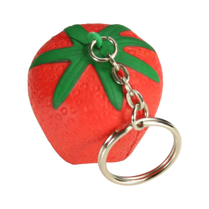 A red strawberry-shaped stress reliever attached to a silver keyring with green leaves on top.