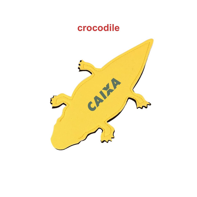 A yellow crocodile-shaped promotional product with a logo on its body.