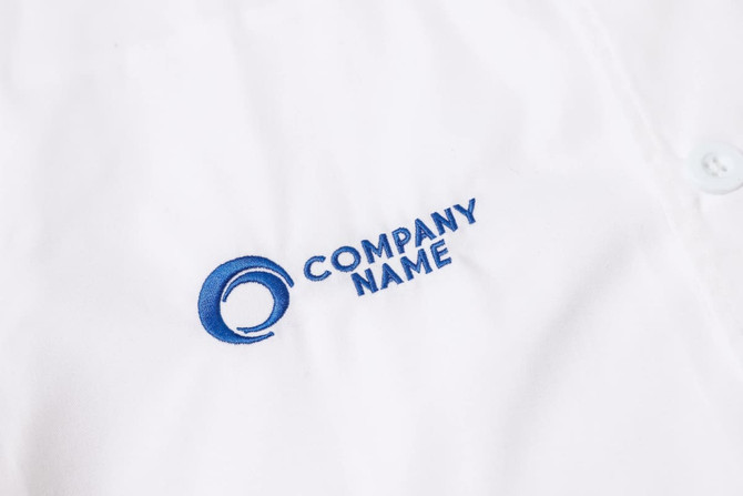 A white chef jacket featuring a blue logo and single-breasted design.
