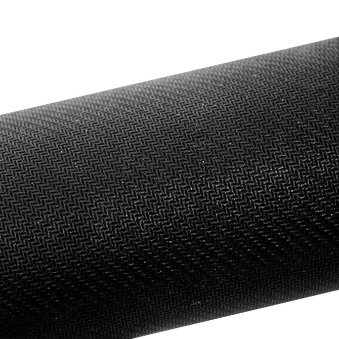 A black rubber desk mat with a textured surface. It features a logo or branding on one side.